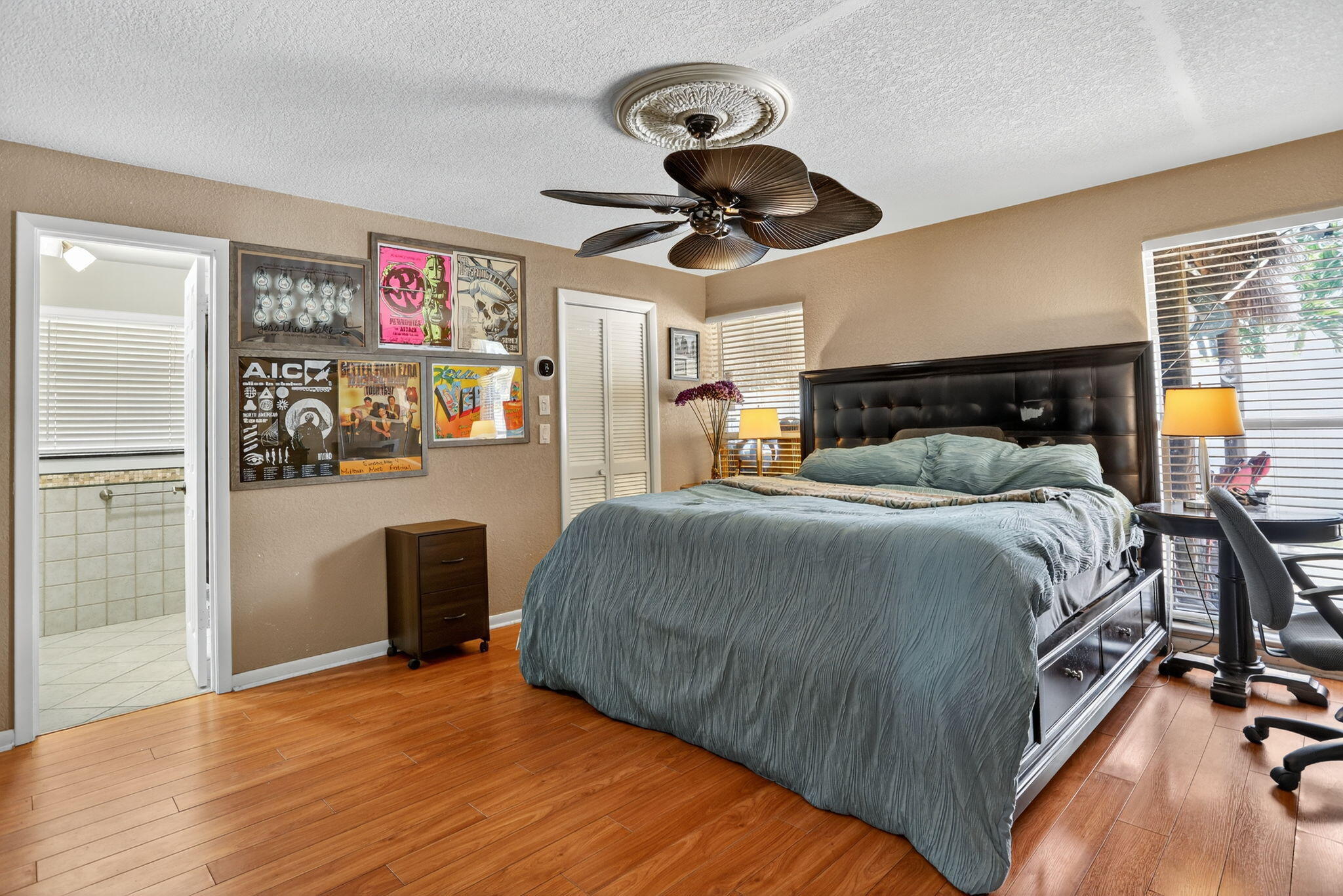 1960 Northeast 31st Street Lighthouse Point, FL 33064 - Photo 15 of 27 a bedroom with a bed and wooden floor