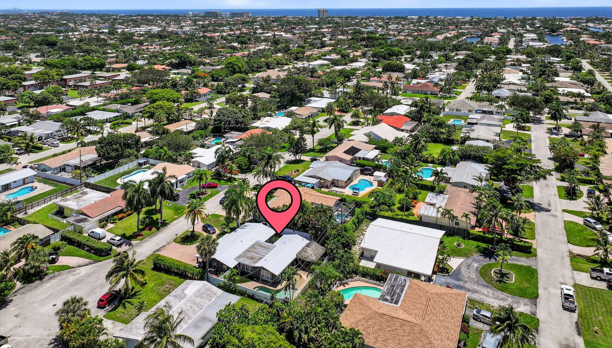 1960 Northeast 31st Street Lighthouse Point, FL 33064 - Photo 26 of 27 an aerial view of red and white house with outdoor space