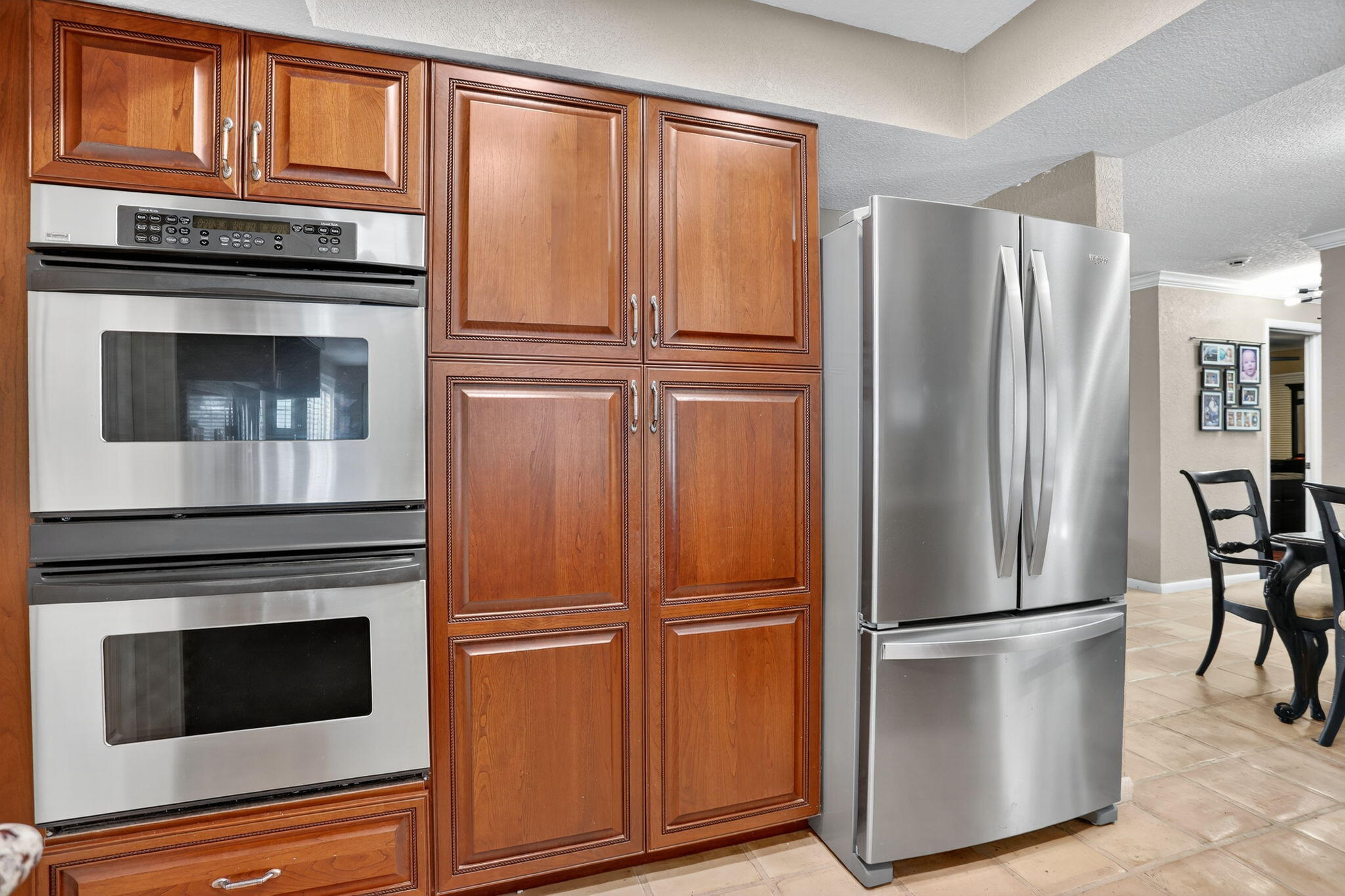 1960 Northeast 31st Street Lighthouse Point, FL 33064 - Photo 7 of 27 a kitchen with metallic refrigerator freezer and a stove top oven