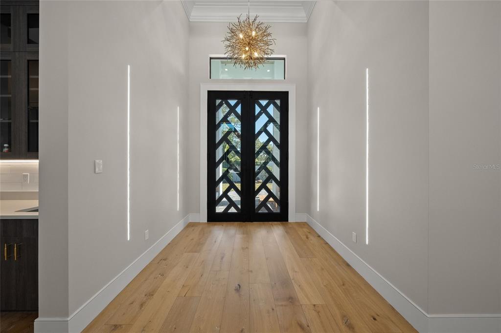 4050 Camino Real Sarasota, FL 34231 - Photo 14 of 59 a view of an entryway with wooden floor
