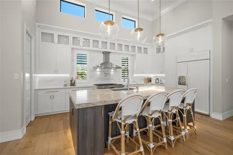 a kitchen with stainless steel appliances granite countertop a sink and stove