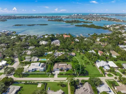 a aerial view of a house with garden and a sitting area