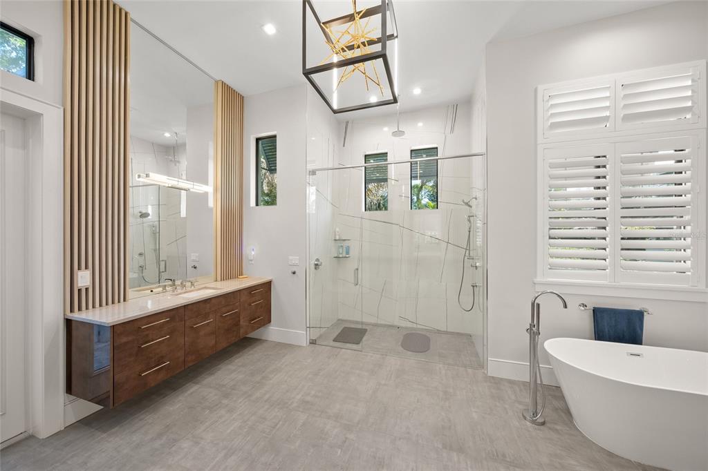 4050 Camino Real Sarasota, FL 34231 - Photo 27 of 59 a bathroom with a bathtub and a shower