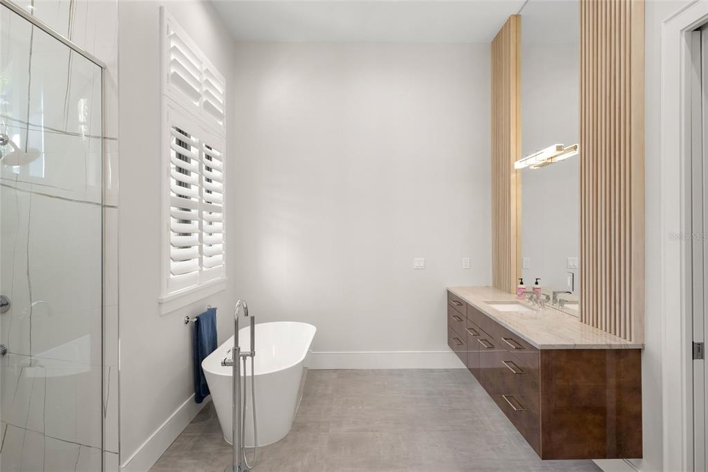 4050 Camino Real Sarasota, FL 34231 - Photo 29 of 59 a bathroom with a sink and a mirror