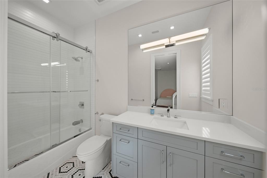 4050 Camino Real Sarasota, FL 34231 - Photo 34 of 59 a bathroom with a sink a toilet and shower