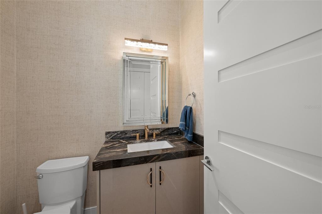 4050 Camino Real Sarasota, FL 34231 - Photo 38 of 59 a bathroom with a granite countertop sink and a mirror