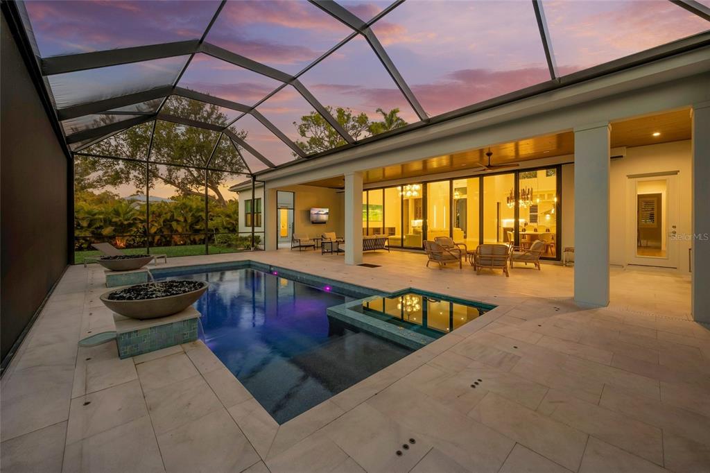 4050 Camino Real Sarasota, FL 34231 - Photo 53 of 59 a view of a swimming pool with a patio