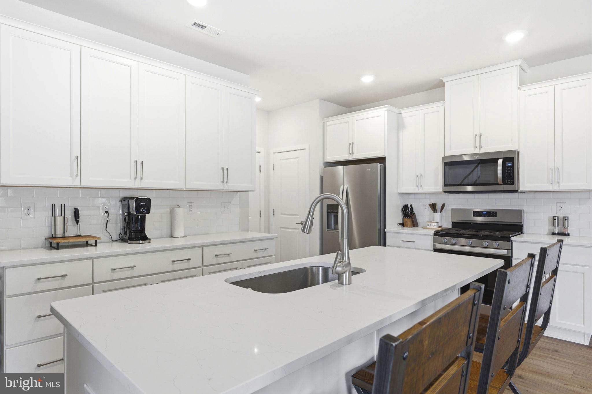 727 Hunsberger Road Spring City, PA 19475 - Photo 8 of 56 Sleek modern kitchen with bright finishes.