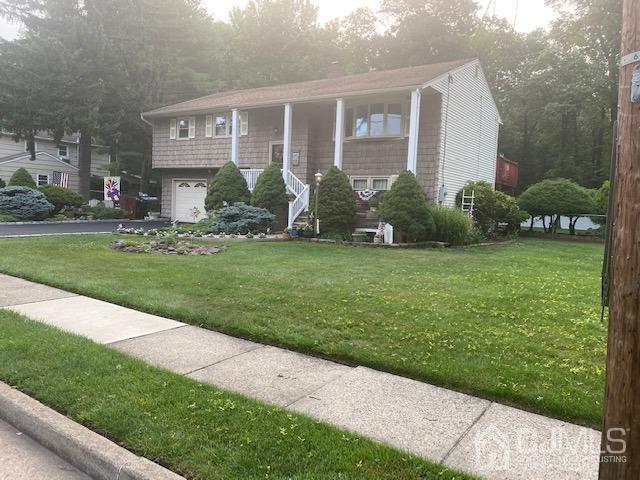 8 Warwick Road Edison, NJ 08820 - Photo 1 of 51 a front view of a house with garden