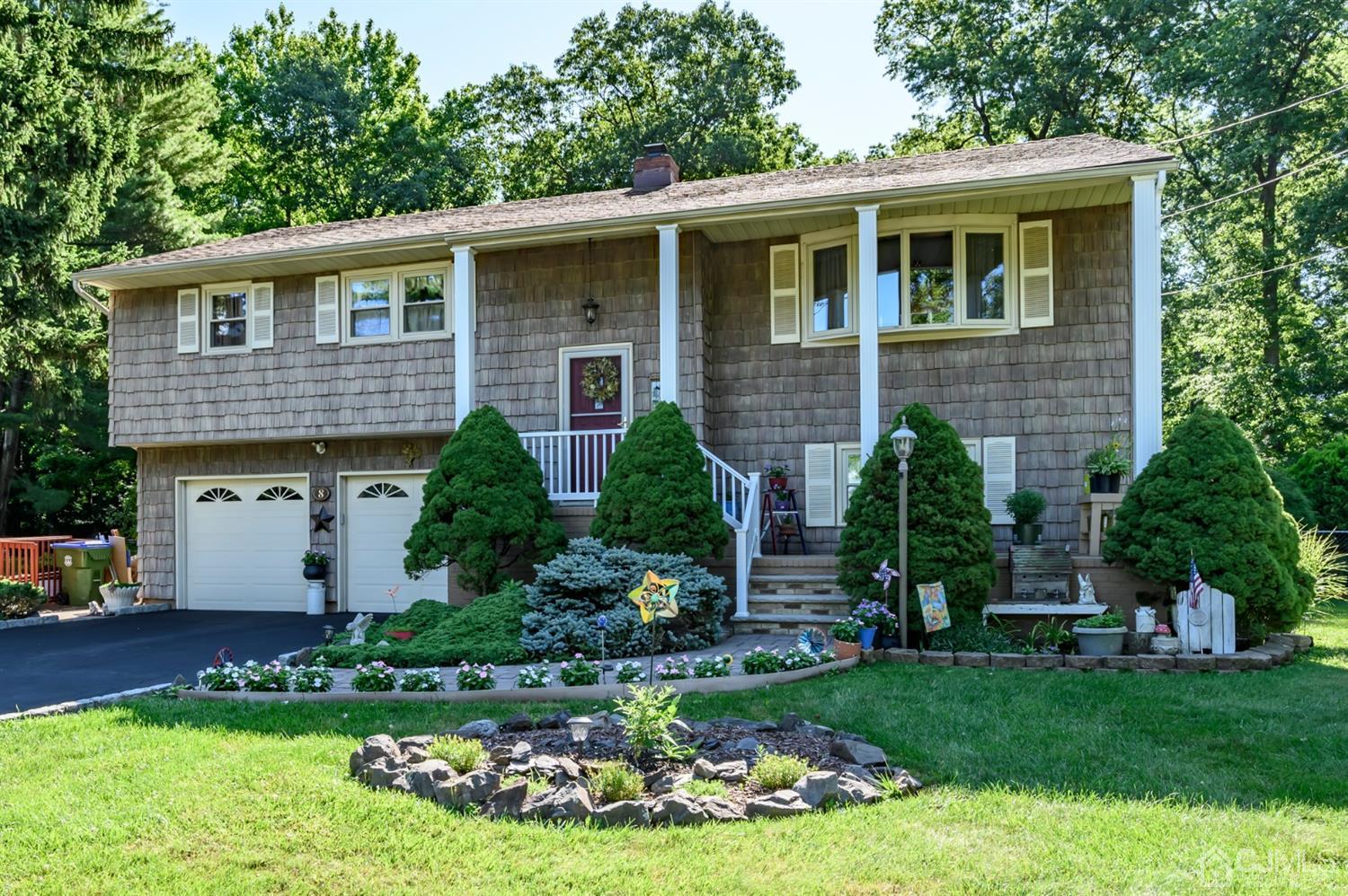 8 Warwick Road Edison, NJ 08820 - Photo 2 of 51 a front view of a house with a yard and potted plants