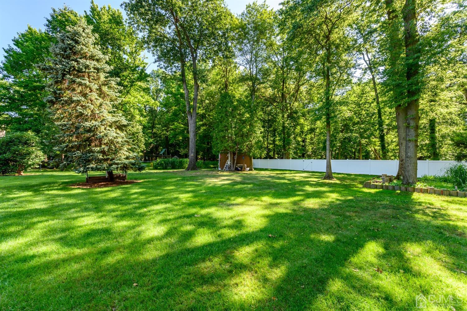 8 Warwick Road Edison, NJ 08820 - Photo 15 of 51 a view of outdoor space with deck and yard