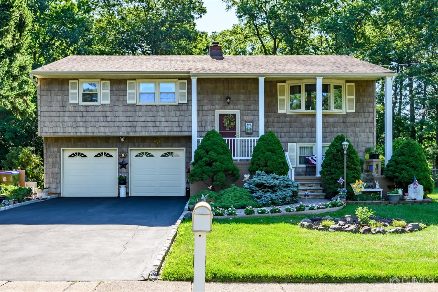 8 Warwick Road Edison, NJ 08820 - Photo 3 of 51 a front view of a house with a yard