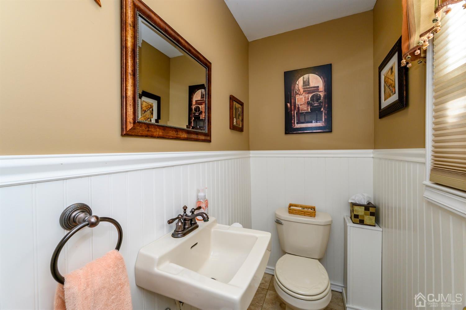 8 Warwick Road Edison, NJ 08820 - Photo 28 of 51 a bathroom with a toilet sink and mirror