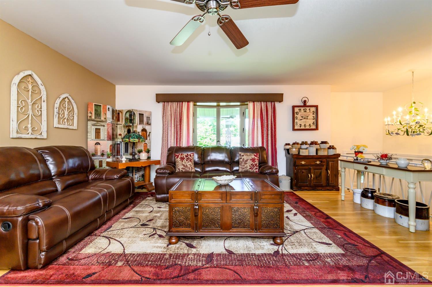 8 Warwick Road Edison, NJ 08820 - Photo 33 of 51 a living room with furniture and a flat screen tv