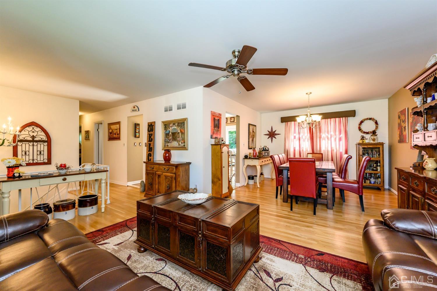 8 Warwick Road Edison, NJ 08820 - Photo 34 of 51 a living room with furniture kitchen view and a wooden floor