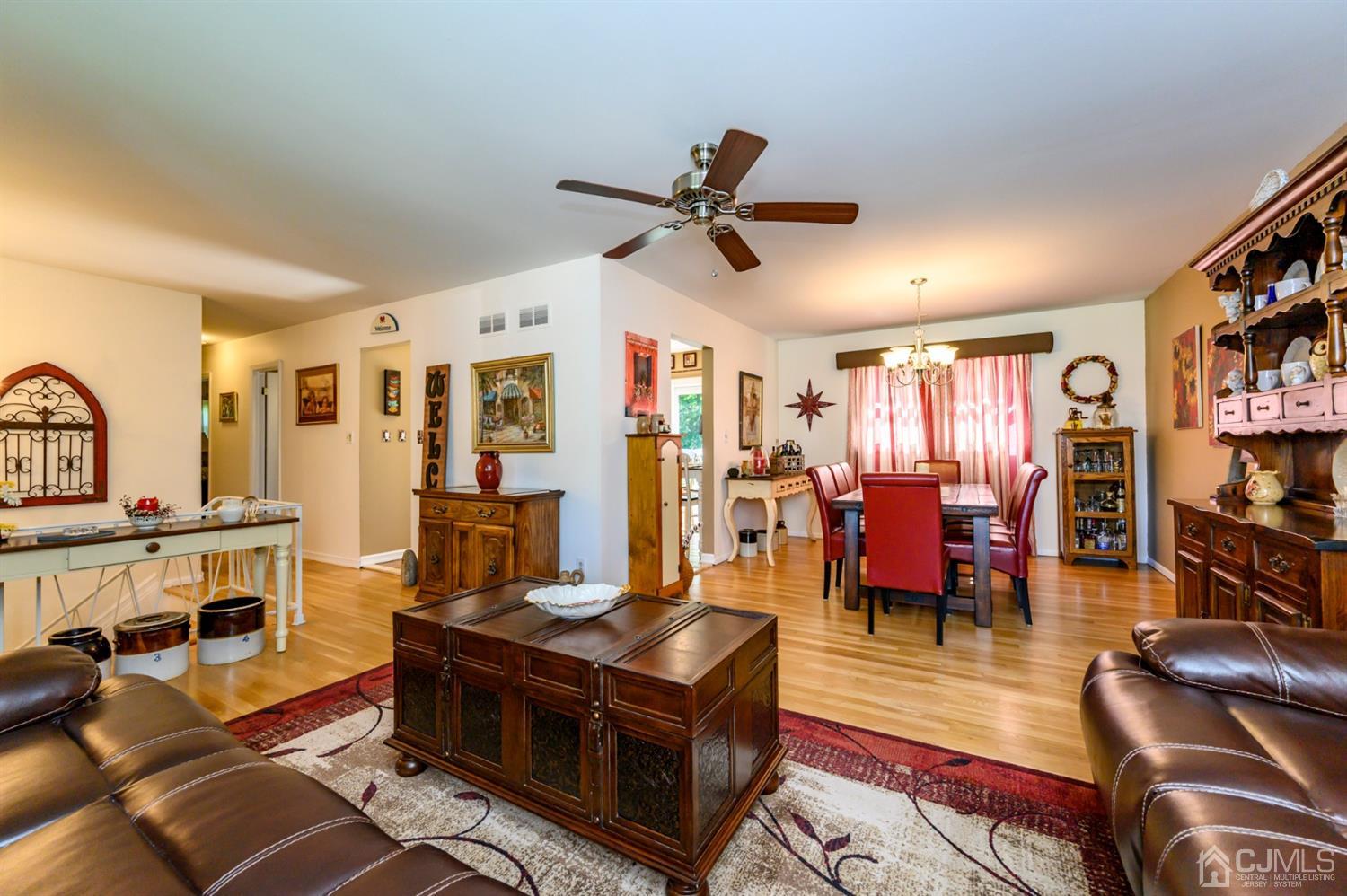 8 Warwick Road Edison, NJ 08820 - Photo 35 of 51 a living room with furniture kitchen view and a large window