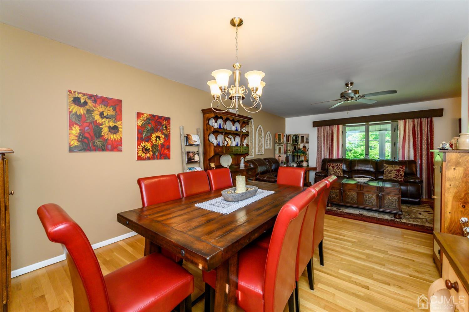 8 Warwick Road Edison, NJ 08820 - Photo 36 of 51 a view of a dining room with furniture a chandelier and wooden floor