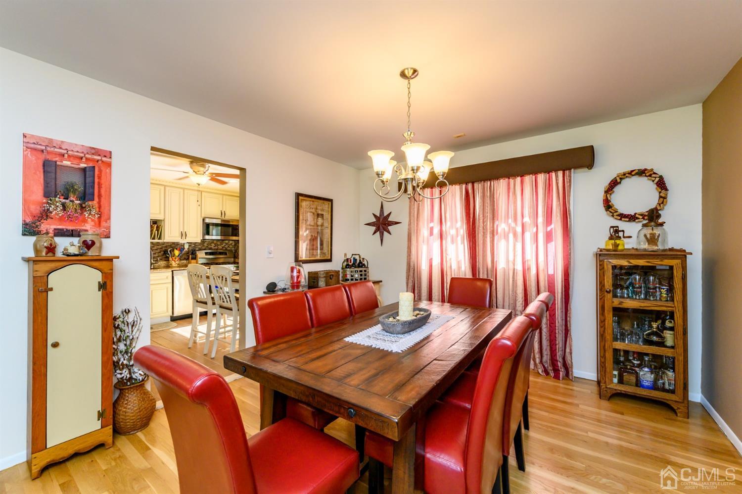 8 Warwick Road Edison, NJ 08820 - Photo 38 of 51 a view of a dining room with furniture window and wooden floor