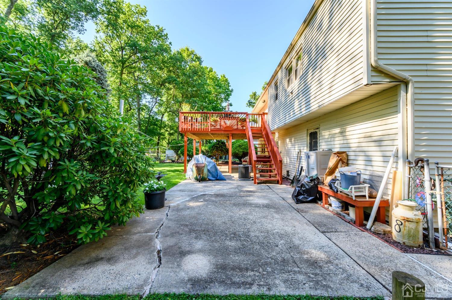 8 Warwick Road Edison, NJ 08820 - Photo 5 of 51 a view of a chairs and tables in the back yard