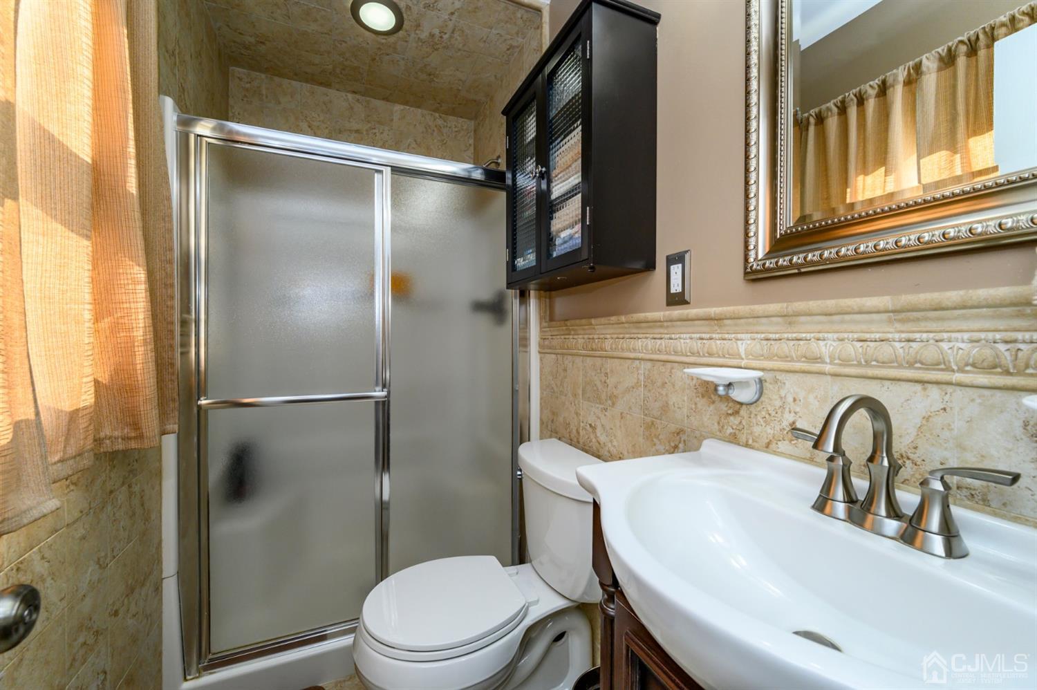 8 Warwick Road Edison, NJ 08820 - Photo 45 of 51 a bathroom with a sink toilet and shower