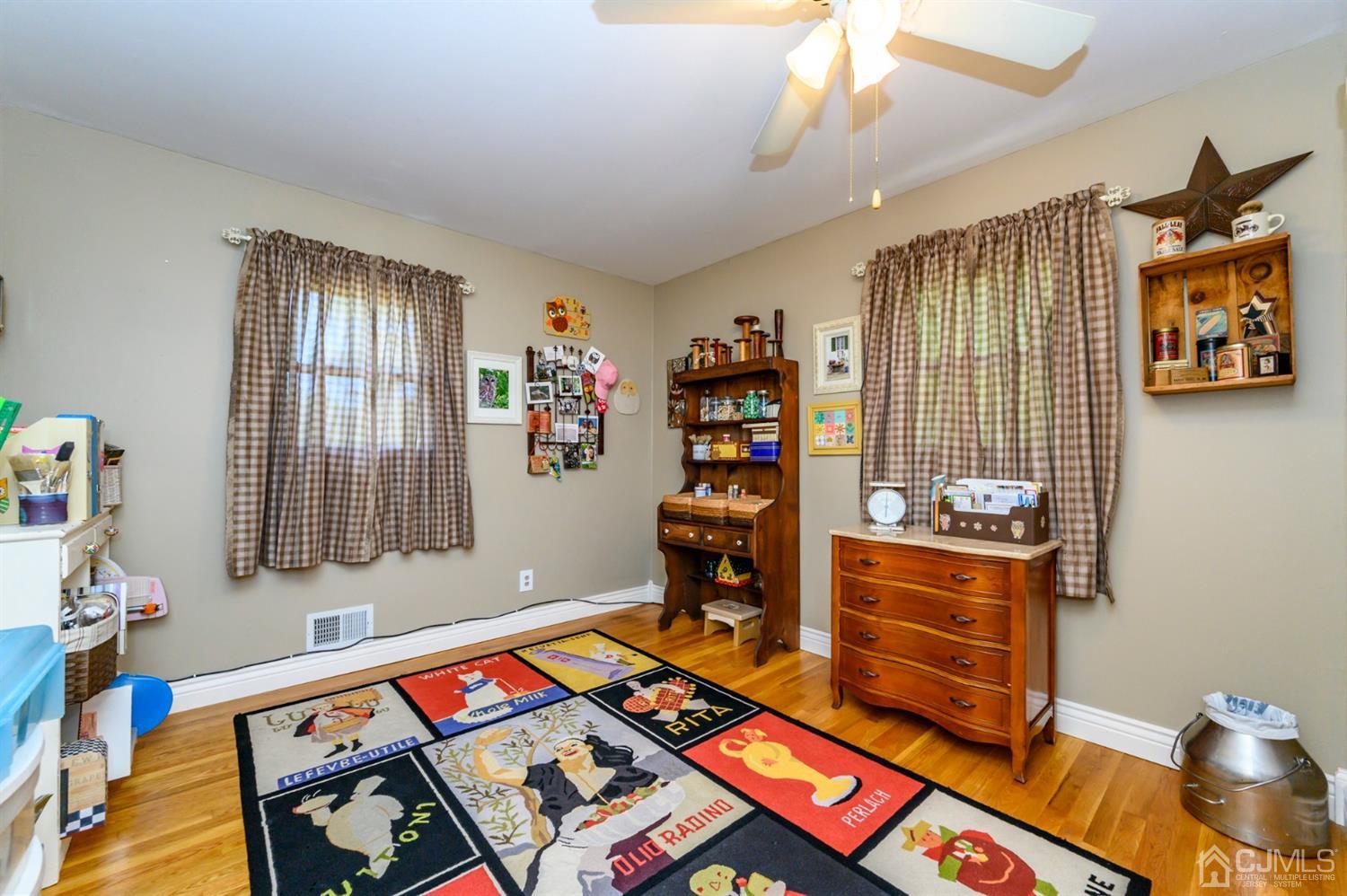 8 Warwick Road Edison, NJ 08820 - Photo 47 of 51 a living room with furniture and a window
