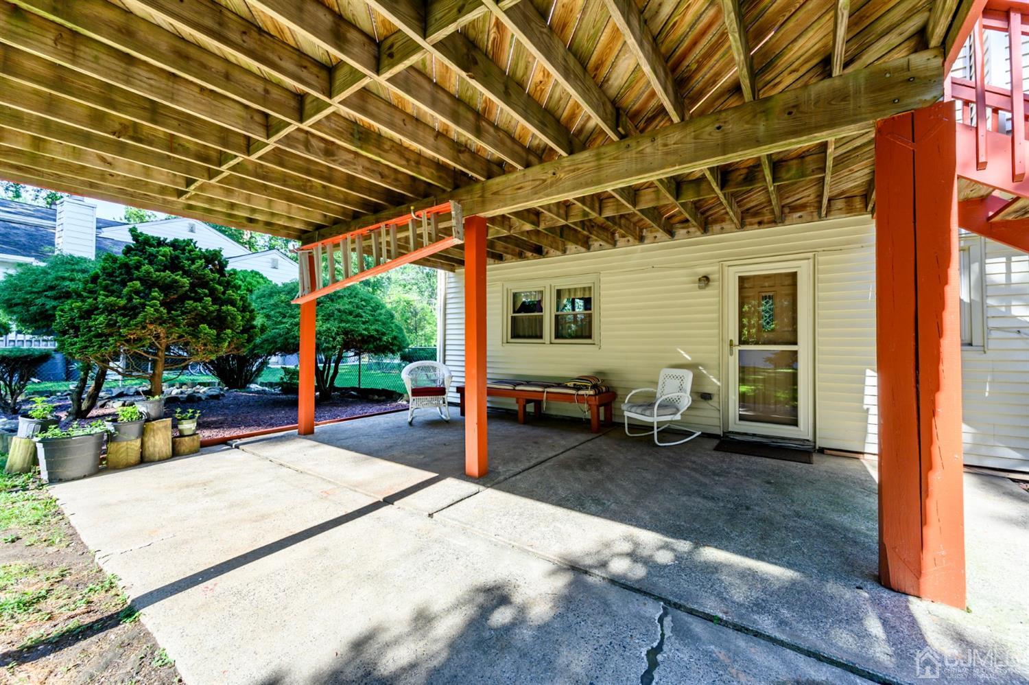 8 Warwick Road Edison, NJ 08820 - Photo 7 of 51 a view of a porch with furniture and a garage