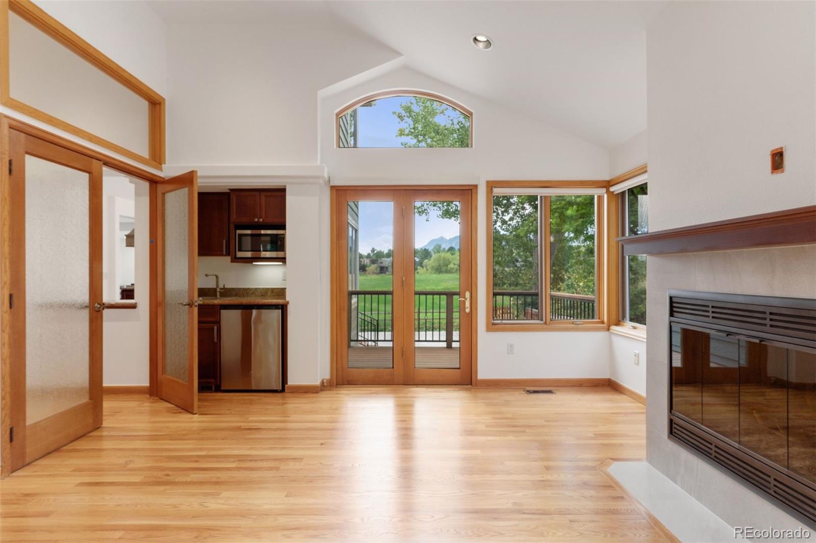 990 Utica Circle Boulder, CO 80304 - Photo 19 of 48 a view of a kitchen with a sink oven window and wooden floor