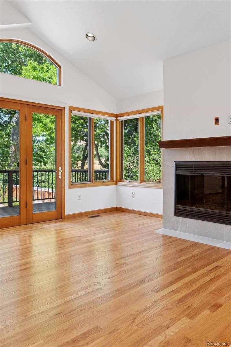 990 Utica Circle Boulder, CO 80304 - Photo 20 of 48 a view of an empty room with wooden floor and a window
