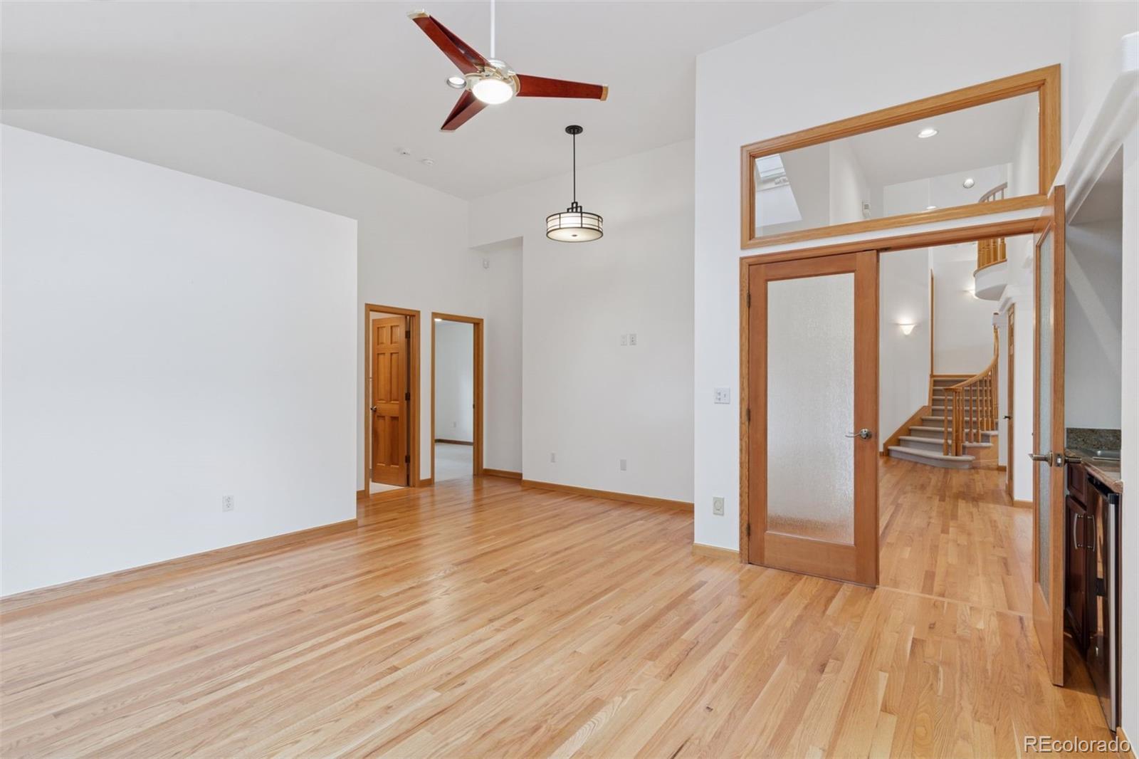 990 Utica Circle Boulder, CO 80304 - Photo 21 of 48 a view of an empty room with wooden floor and a window