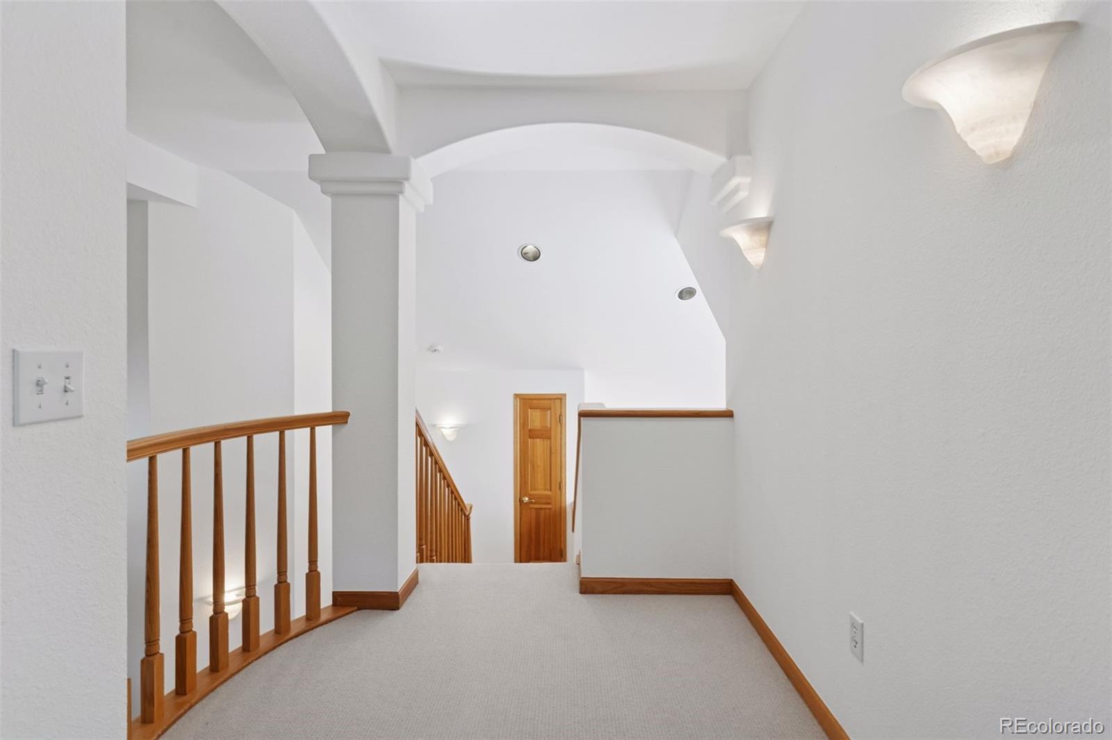 990 Utica Circle Boulder, CO 80304 - Photo 26 of 48 a view of a hallway with staircase