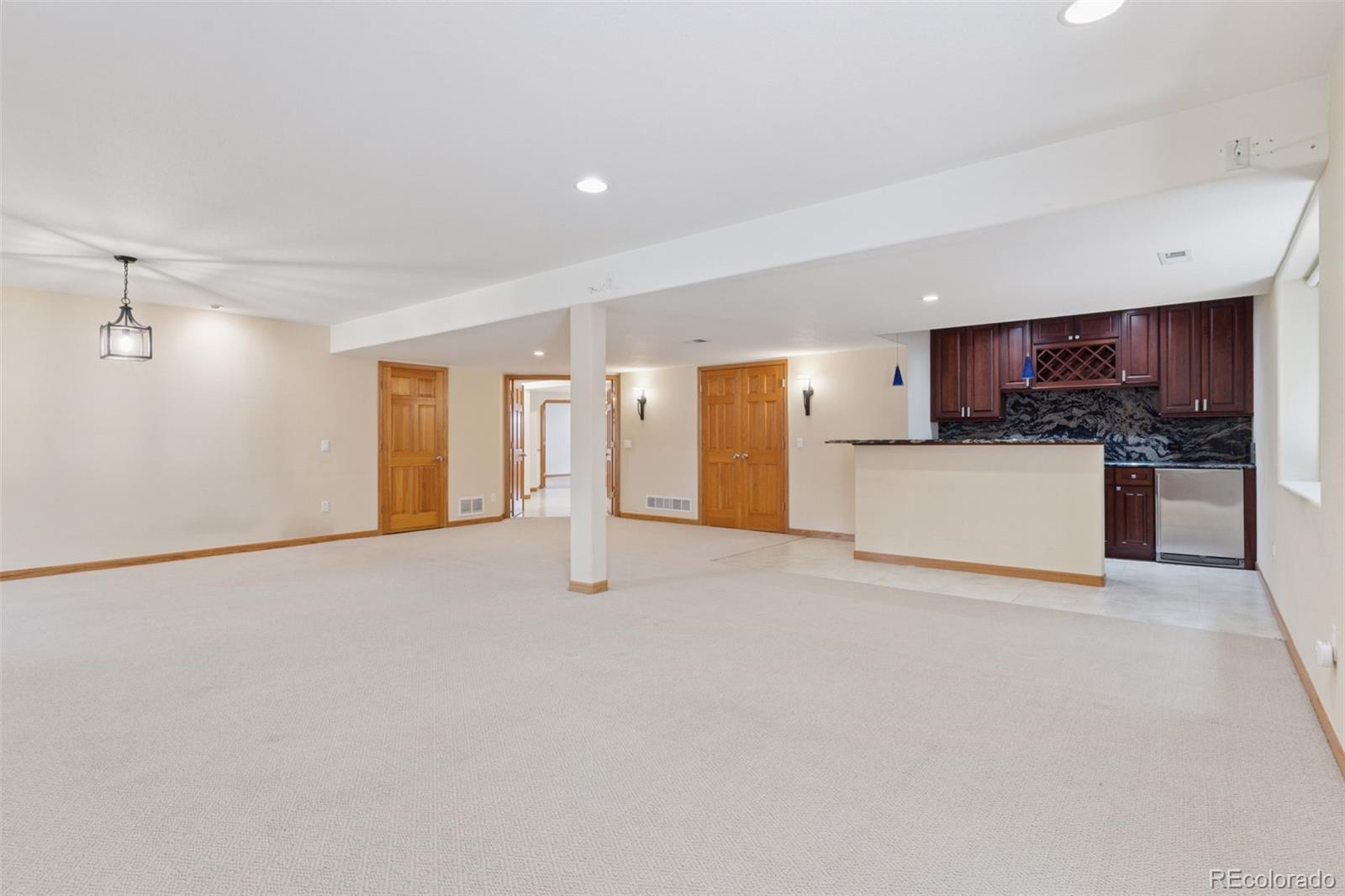 990 Utica Circle Boulder, CO 80304 - Photo 32 of 48 a view of a kitchen with a sink and a refrigerator