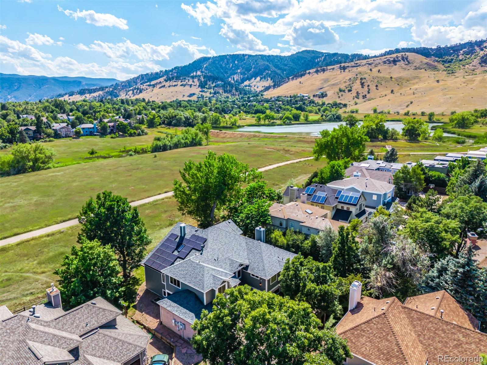 990 Utica Circle Boulder, CO 80304 - Photo 42 of 48 an aerial view of a house with a garden and lake view