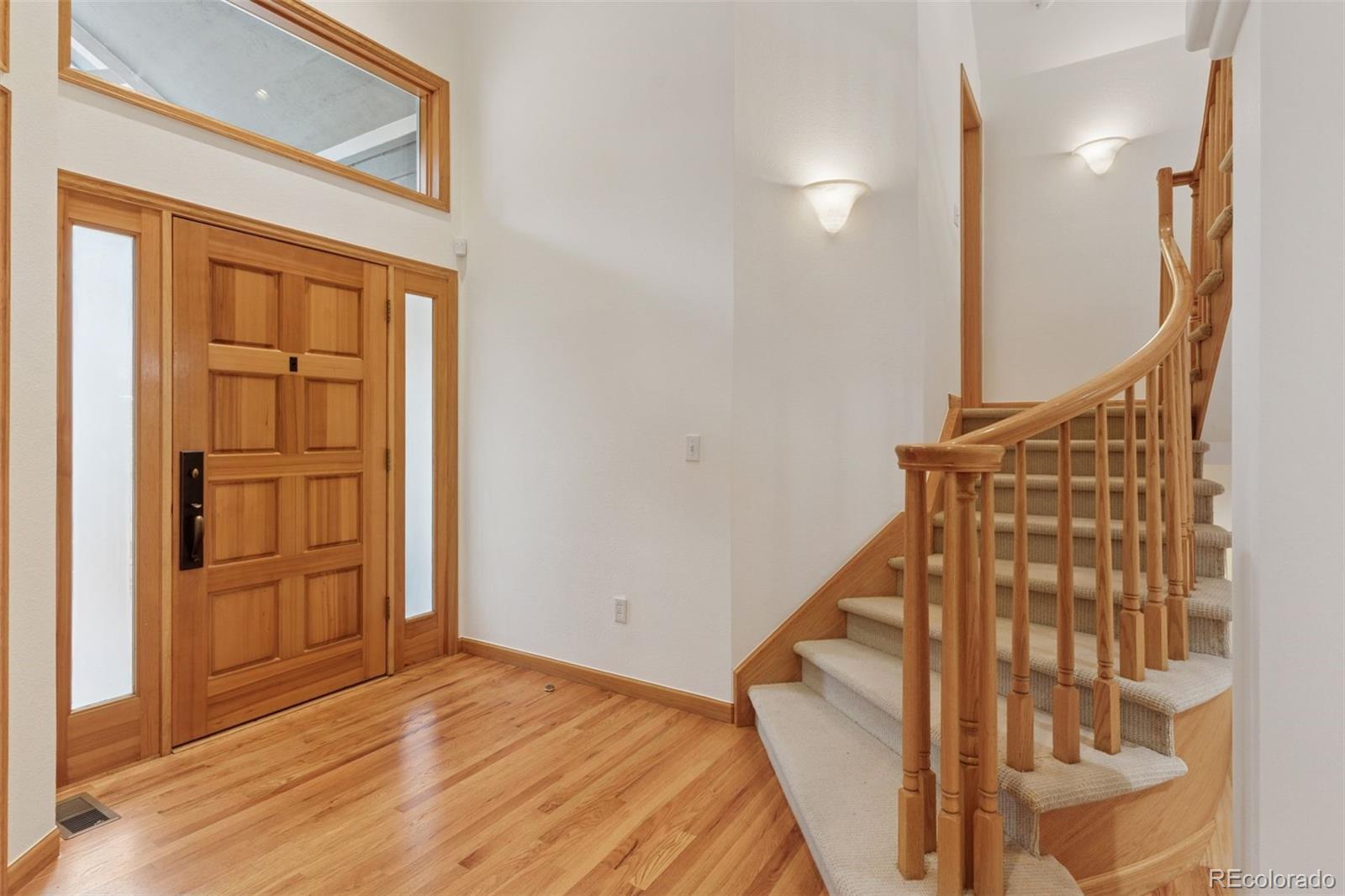 990 Utica Circle Boulder, CO 80304 - Photo 5 of 48 hallway with wooden floor and entryway