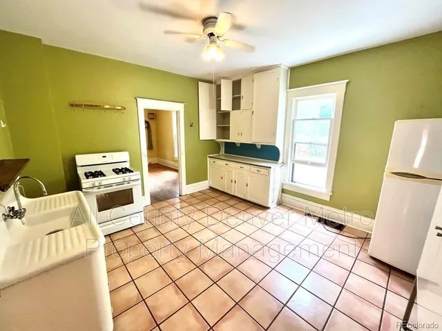 a bedroom with a bed and a table in it