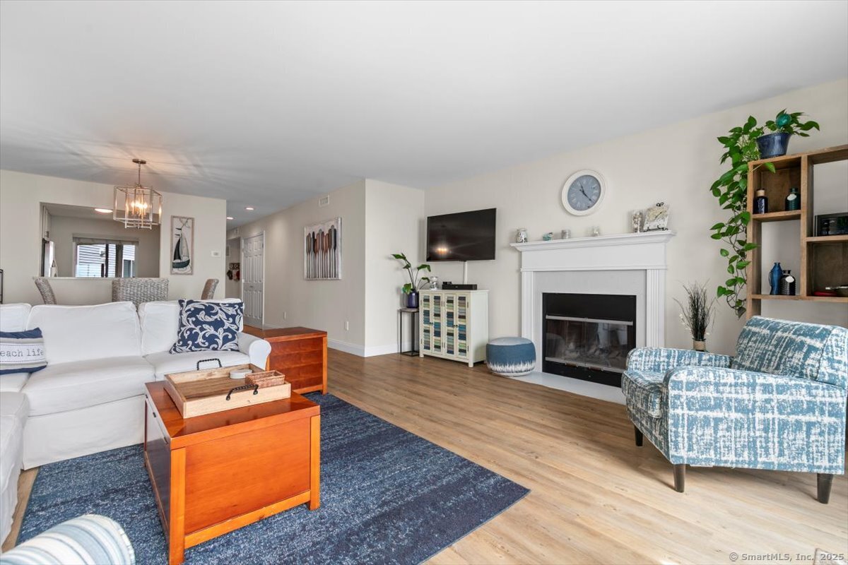 1 Mansfield Grove Road, Unit 206 East Haven, CT 06512 - Photo 40 of 40 a living room with furniture and a fireplace