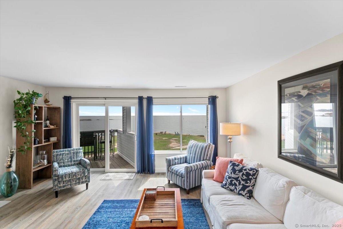 1 Mansfield Grove Road, Unit 206 East Haven, CT 06512 - Photo 17 of 40 a living room with furniture and a large window