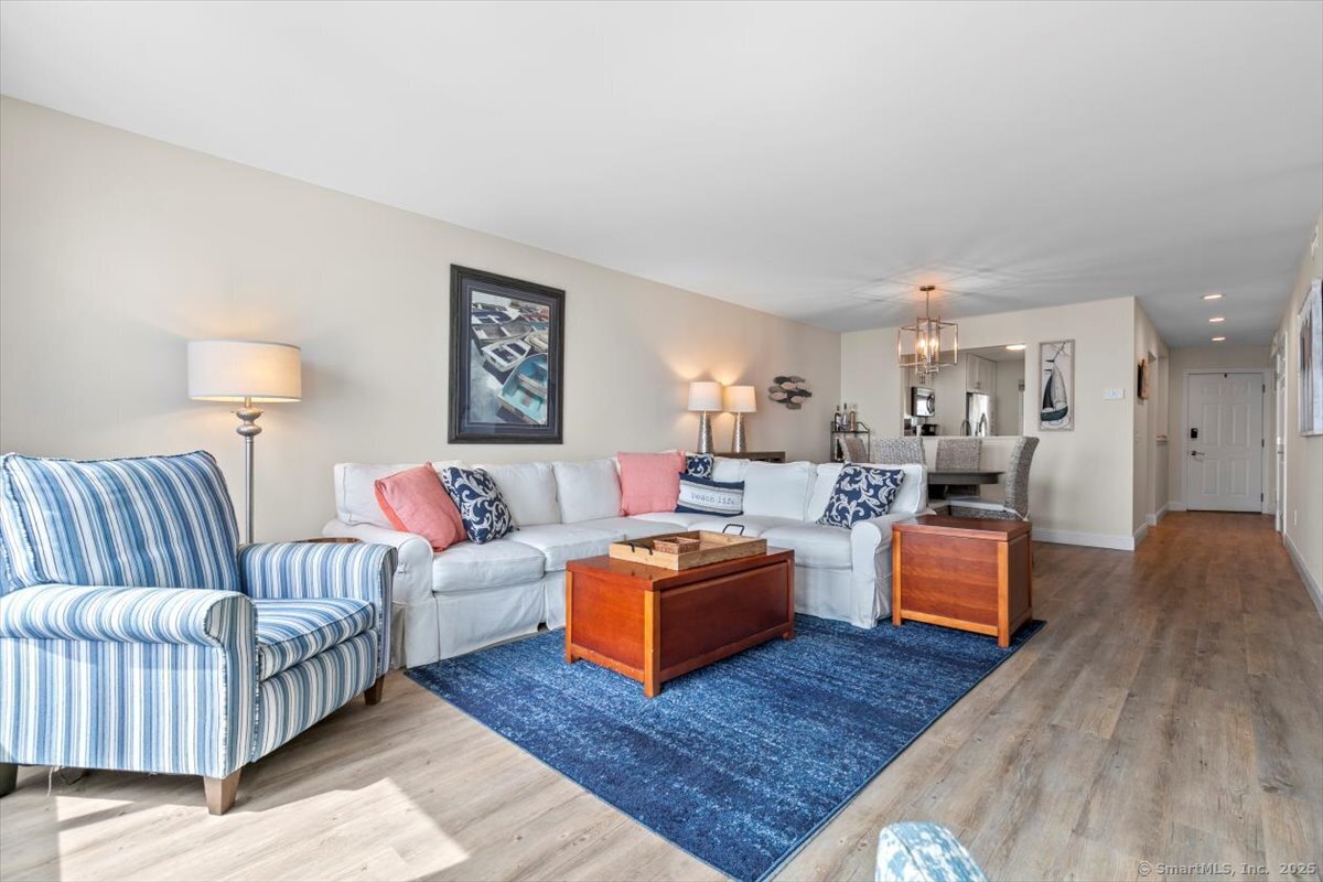 1 Mansfield Grove Road, Unit 206 East Haven, CT 06512 - Photo 18 of 40 a living room with furniture and wooden floor