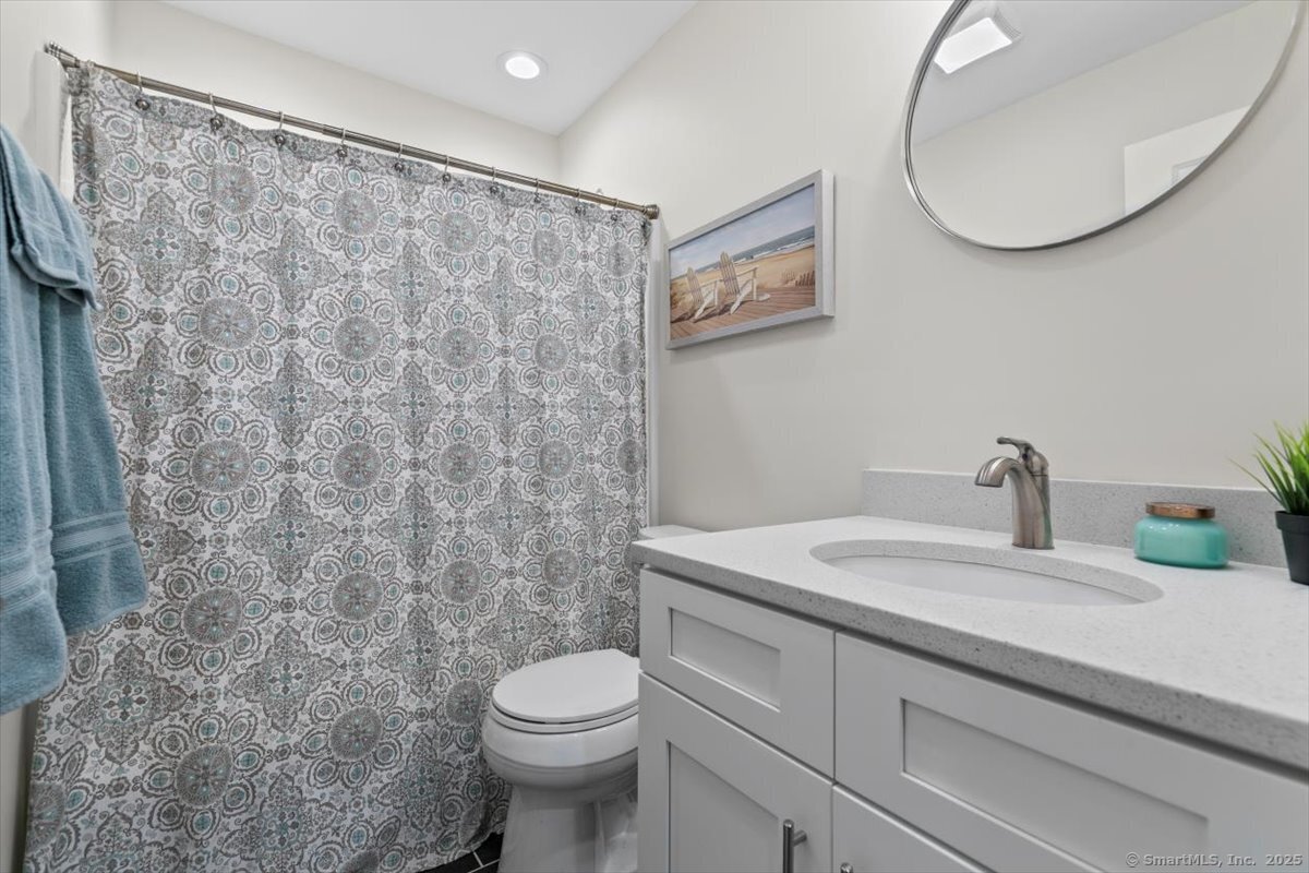 1 Mansfield Grove Road, Unit 206 East Haven, CT 06512 - Photo 22 of 40 a bathroom with a sink and a mirror