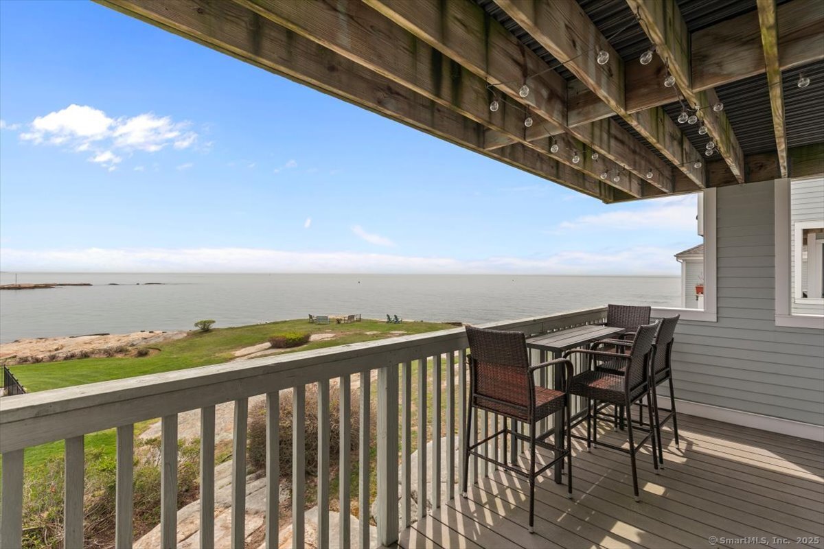 1 Mansfield Grove Road, Unit 206 East Haven, CT 06512 - Photo 28 of 40 a view of a balcony with an outdoor seating