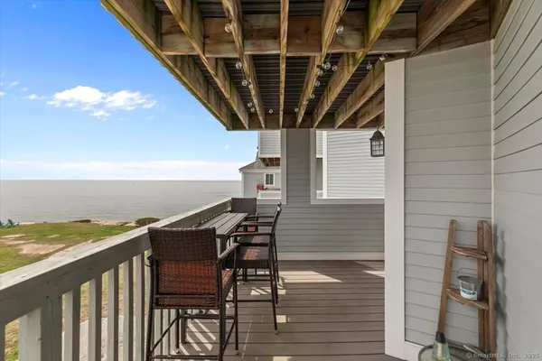 a view of a balcony with an outdoor seating