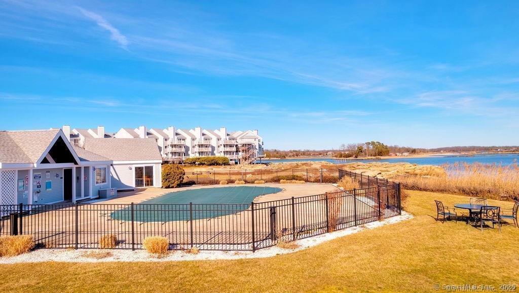 1 Mansfield Grove Road, Unit 206 East Haven, CT 06512 - Photo 34 of 40 a view of a swimming pool with outdoor seating