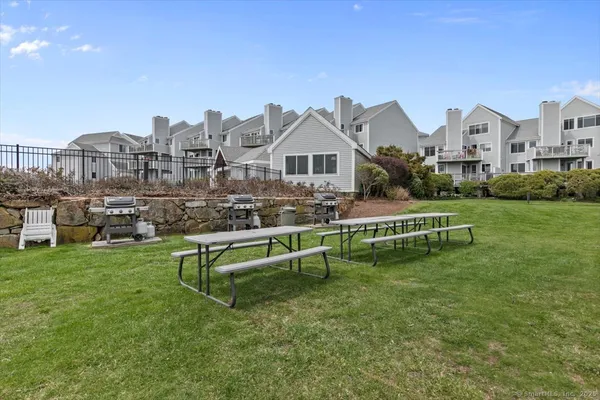 a view of houses with outdoor space and lake view