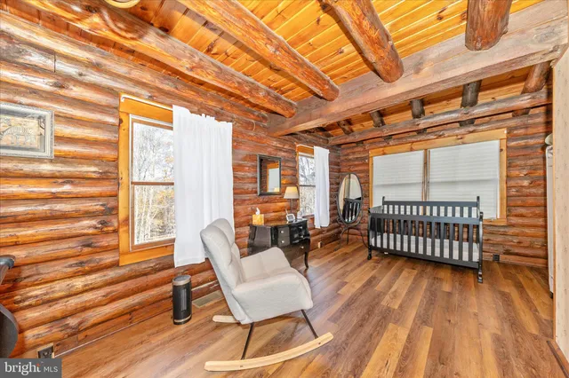 a spacious bathroom with a toilet sink and mirror