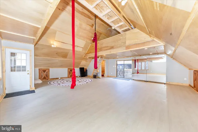 a living room with furniture a fireplace and a table