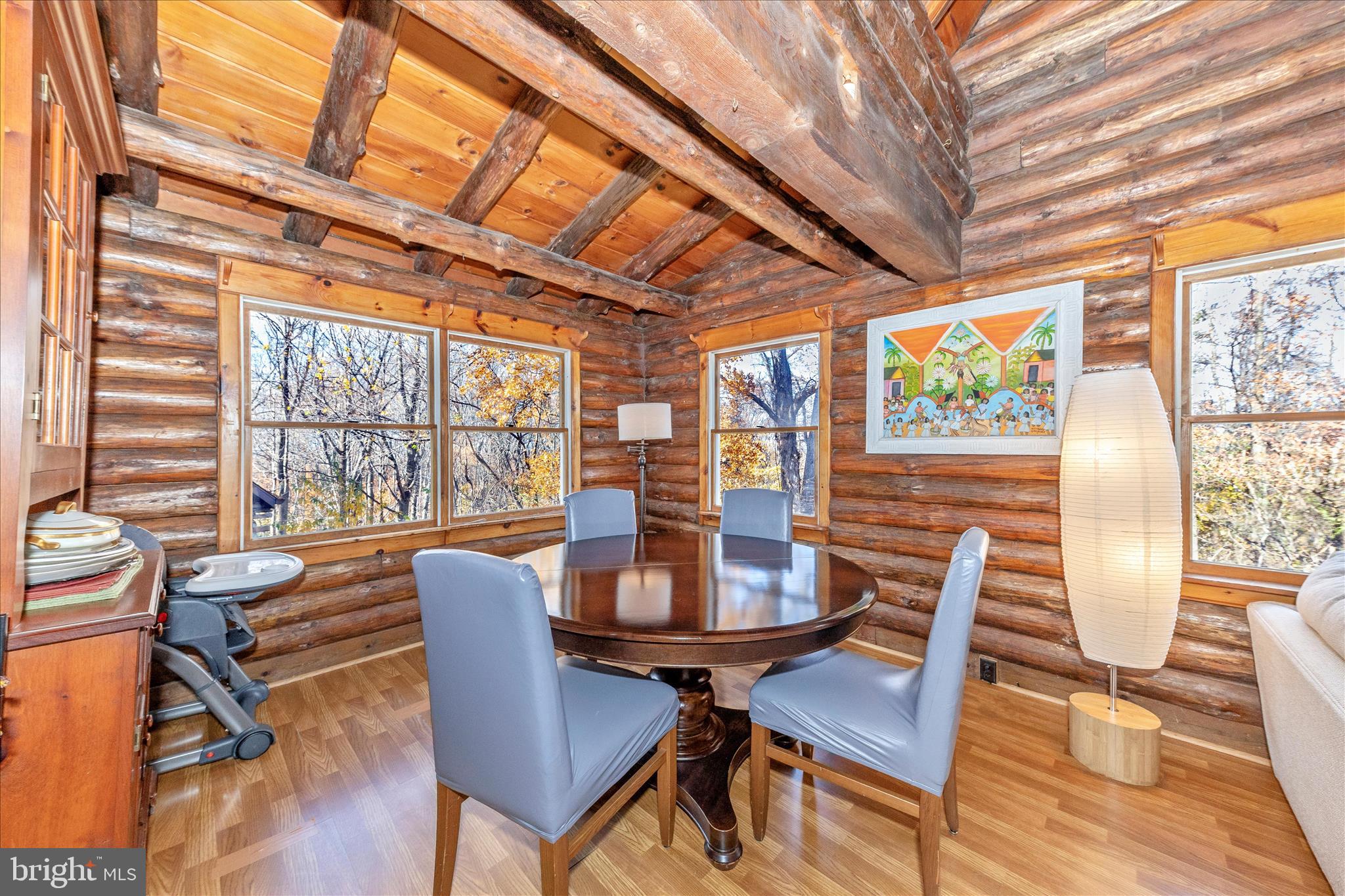 1402 Hoffmaster Road Knoxville, MD 21758 - Photo 9 of 54 a view of a dining room with furniture window and wooden floor