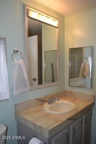 a bathroom with a shower and toilet