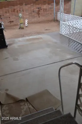 a view of backyard with outdoor seating and plants