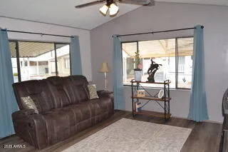 a living room with furniture and a window