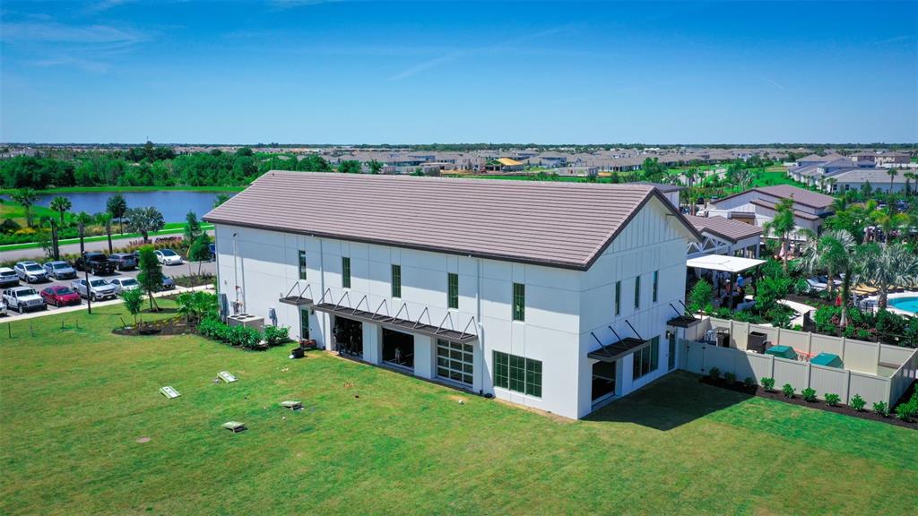 18125 Gander Terrace Lakewood Ranch, FL 34211 - Photo 30 of 50 a aerial view of a house with a garden and deck