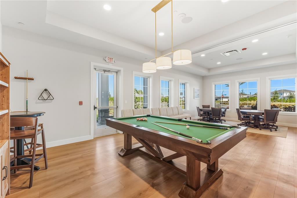 18125 Gander Terrace Lakewood Ranch, FL 34211 - Photo 48 of 50 a room with lots of table and chairs